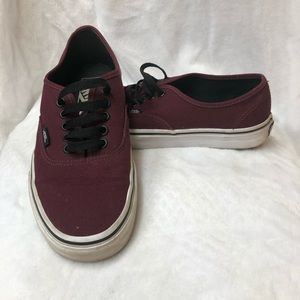 Vans burgundy sneakers off the wall